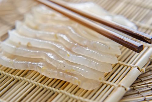 诱人牙签鱼片美食摄影图，广告素材下载